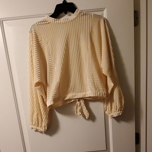 Cream turtleneck with open back